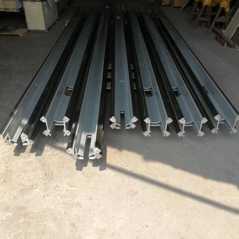 Machined feed beams with slide bars.jpg
